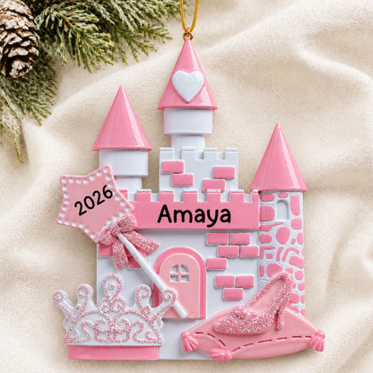 Personalized princess christmas ornament laid on a soft white knit blanket