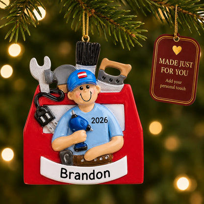 Handyman toolbox christmas ornament hanging on a lit Christmas tree with a Made Just For You gift tag