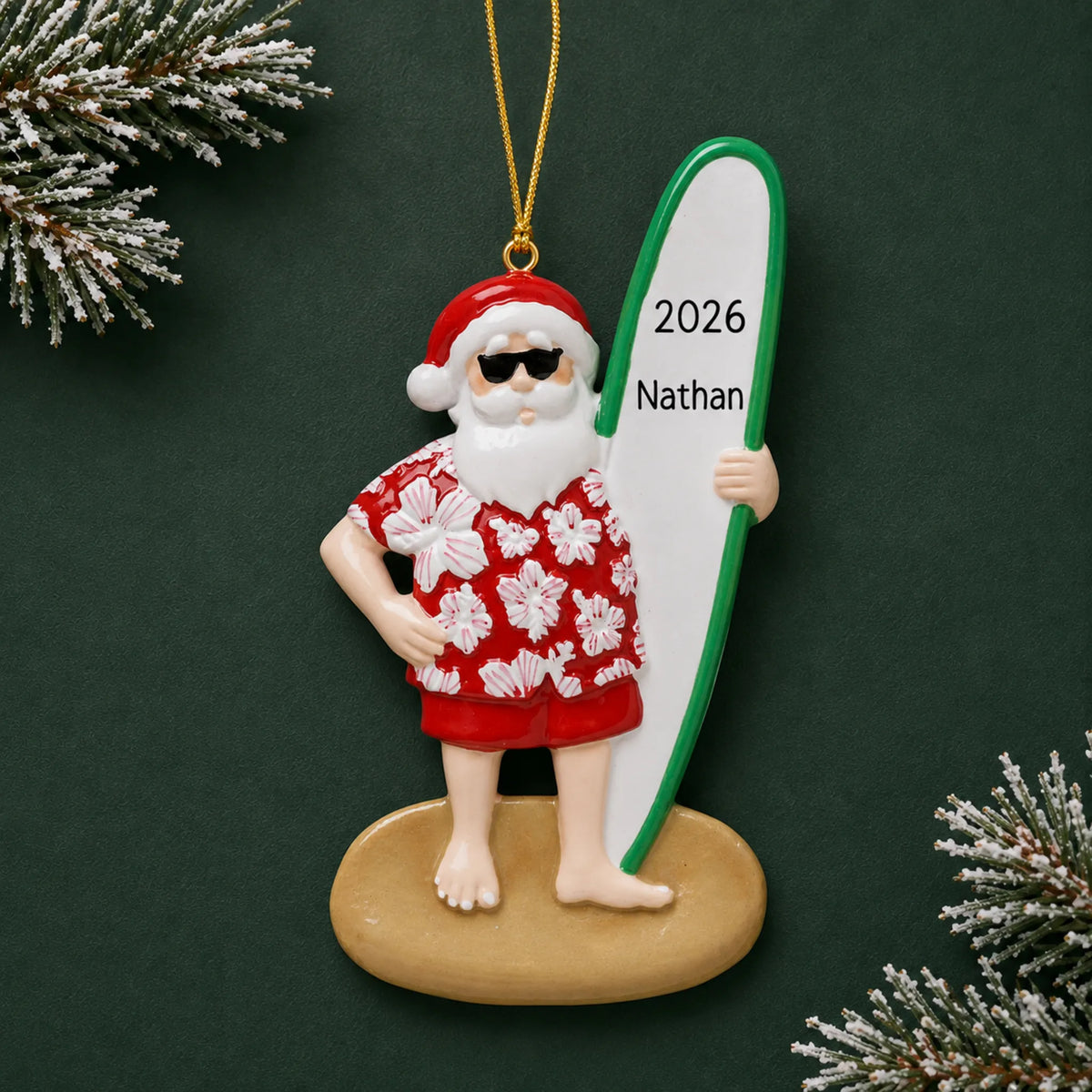 Personalized Santa surfboard christmas ornament on a dark green pine background