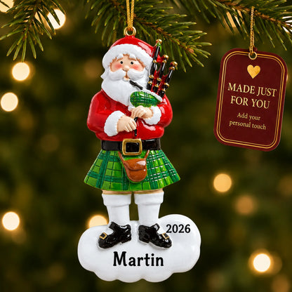 Scottish Bagpipes Santa christmas ornament hanging on a lit Christmas tree with a Made Just For You gift tag