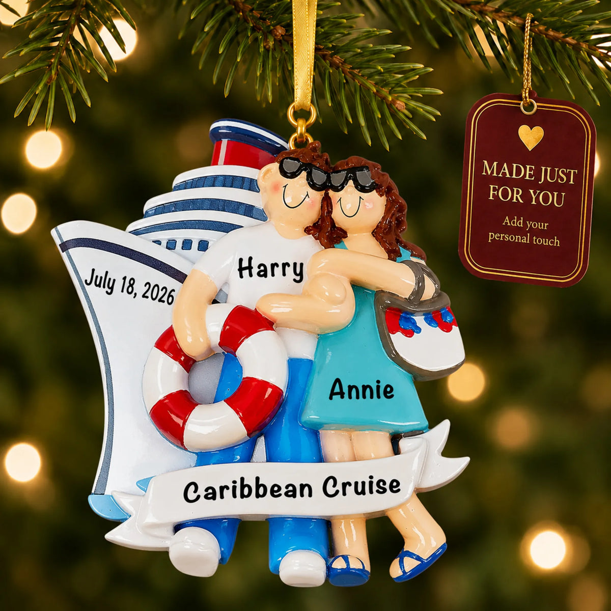 Cruise ship love couple christmas ornament hanging on a lit Christmas tree with a Made Just For You gift tag