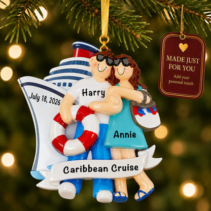 Cruise ship love couple christmas ornament hanging on a lit Christmas tree with a Made Just For You gift tag
