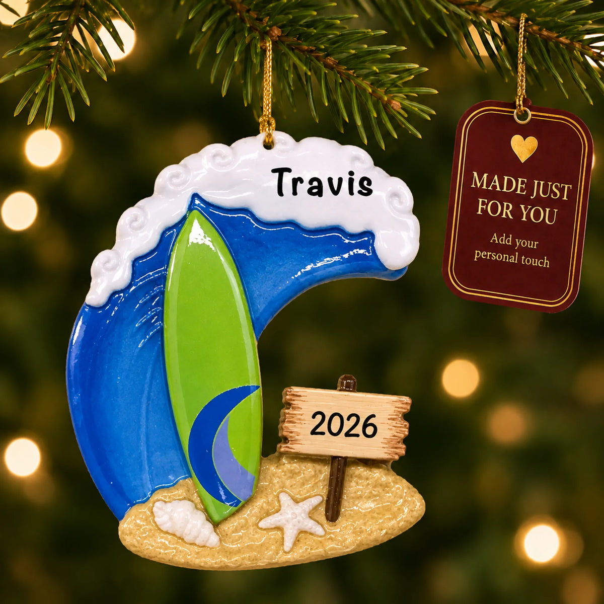 Surfing big wave christmas ornament hanging on a lit Christmas tree with a Made Just For You gift tag