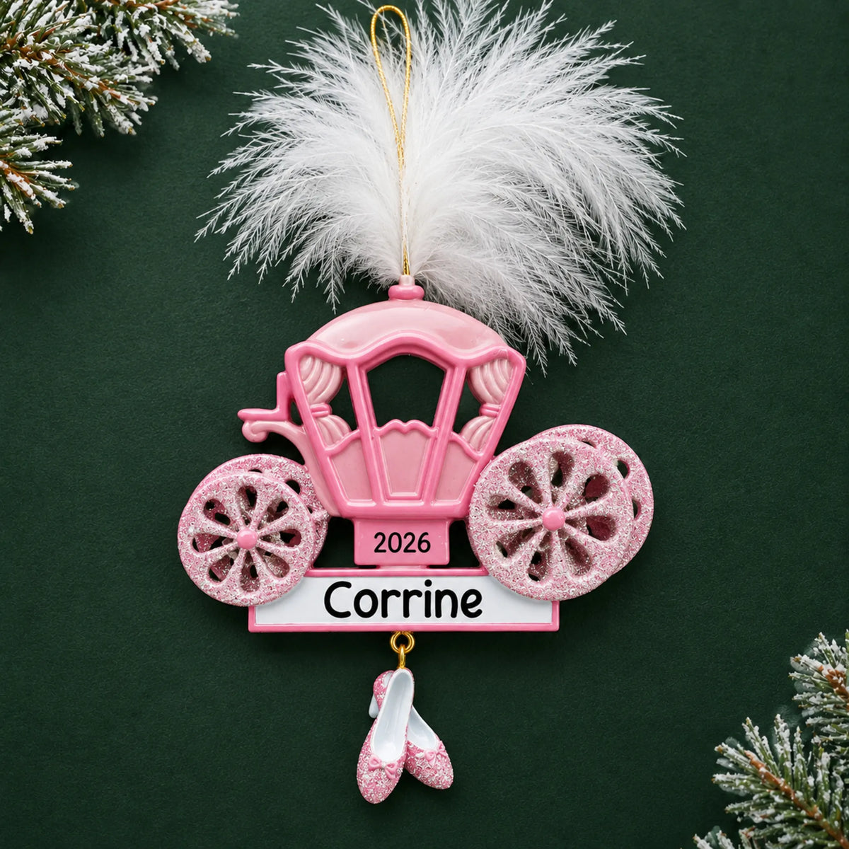 Personalized princess carriage christmas ornament on a dark green pine background