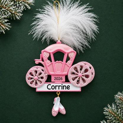 Personalized princess carriage christmas ornament on a dark green pine background