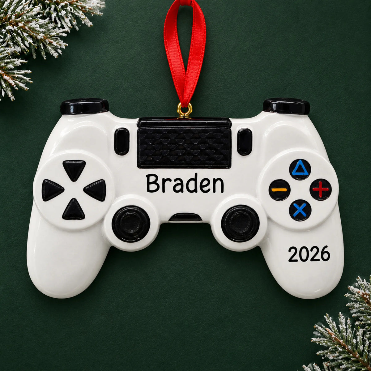 Personalized gaming controller christmas ornament on a dark green pine background