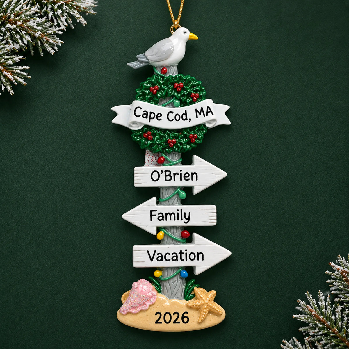 Personalized beach signs christmas ornament on a dark green pine background