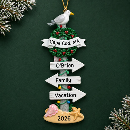 Personalized beach signs christmas ornament on a dark green pine background