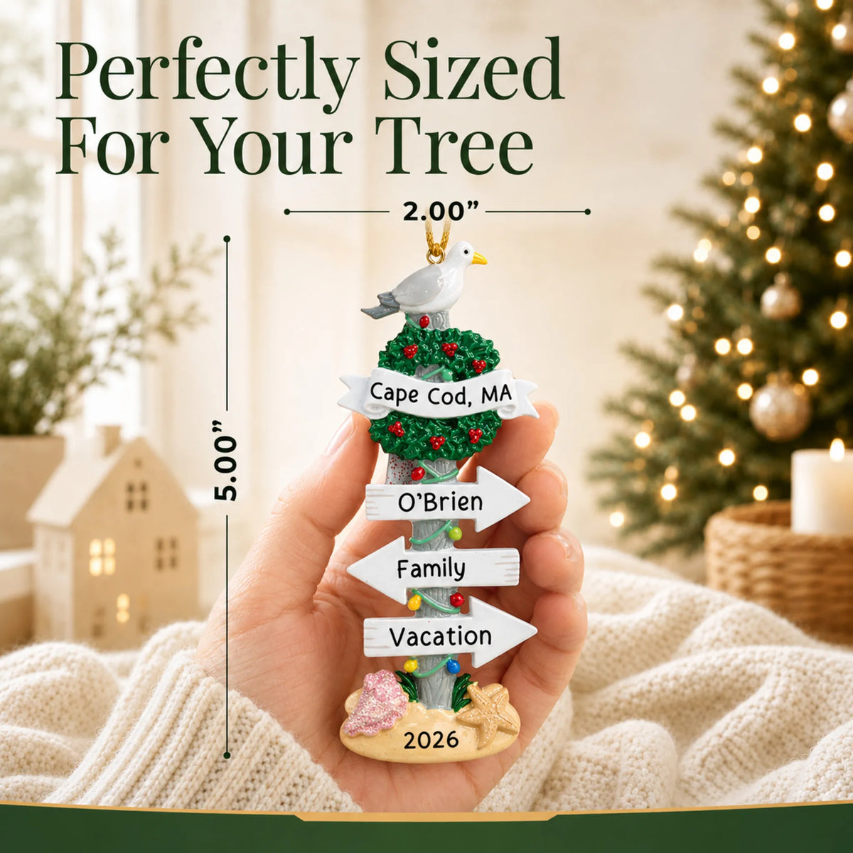 Size guide: the personalized beach signs christmas ornament is 2.00 in wide by 5.00 in tall, shown in hand