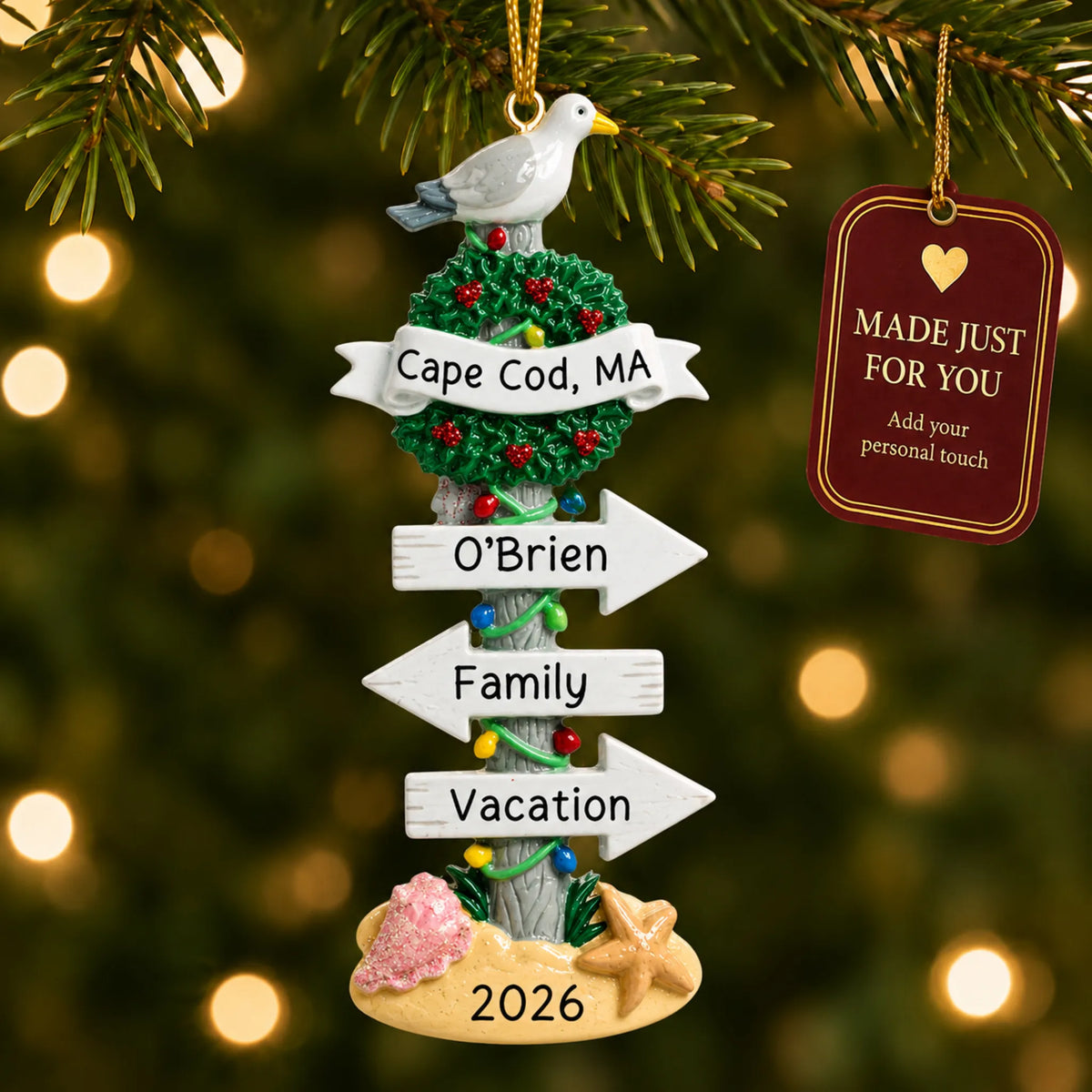 Beach signs christmas ornament hanging on a lit Christmas tree with a Made Just For You gift tag