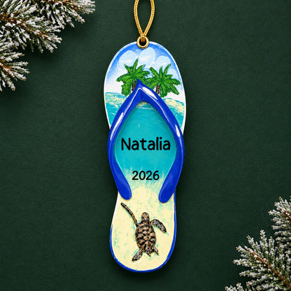 Personalized turtle island flip flop christmas ornament on a dark green pine background