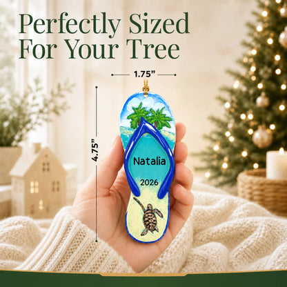 Size guide: the personalized turtle island flip flop christmas ornament is 1.75 in wide by 4.75 in tall, shown in hand