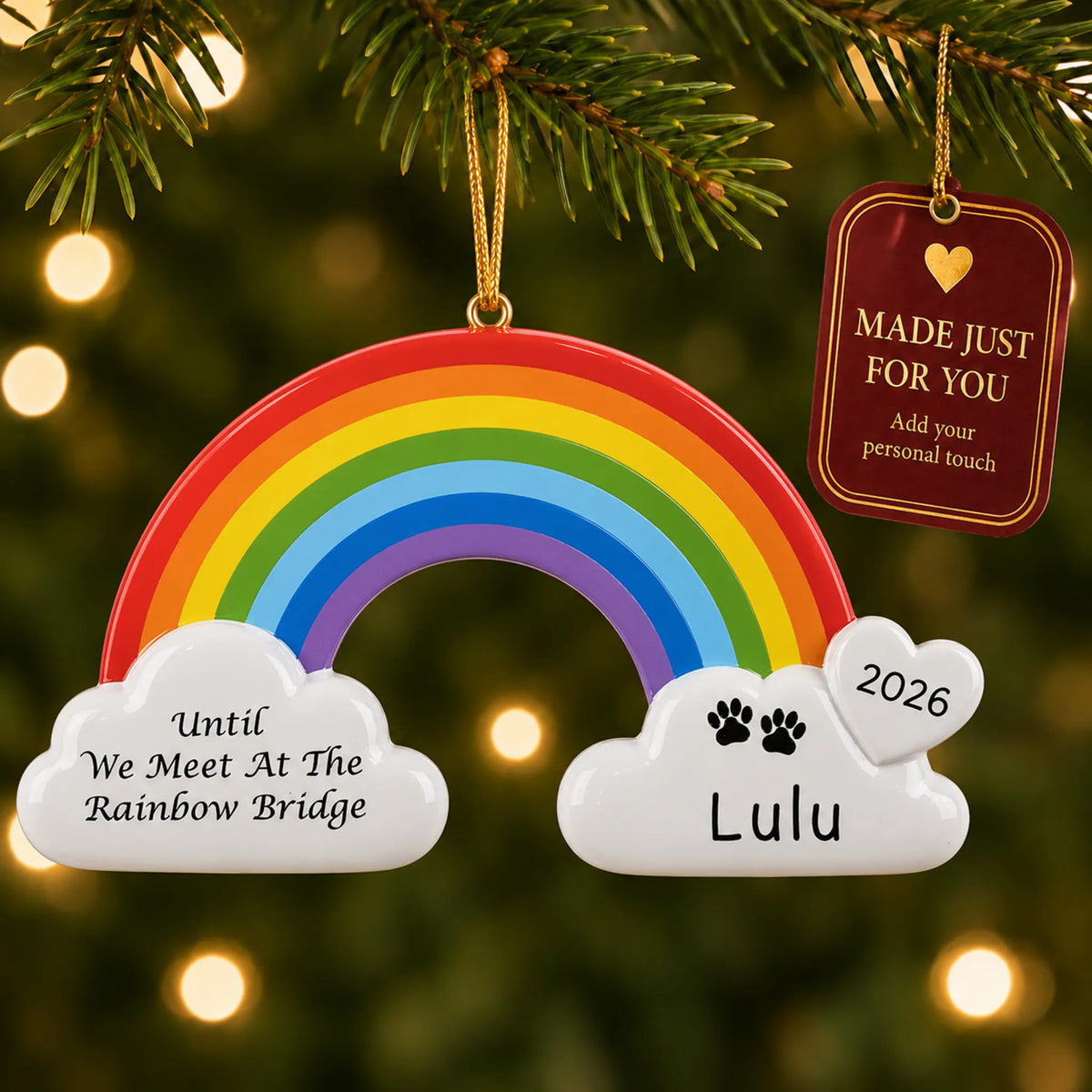 Pet Rainbow Bridge Memorial christmas ornament hanging on a lit Christmas tree with a Made Just For You gift tag