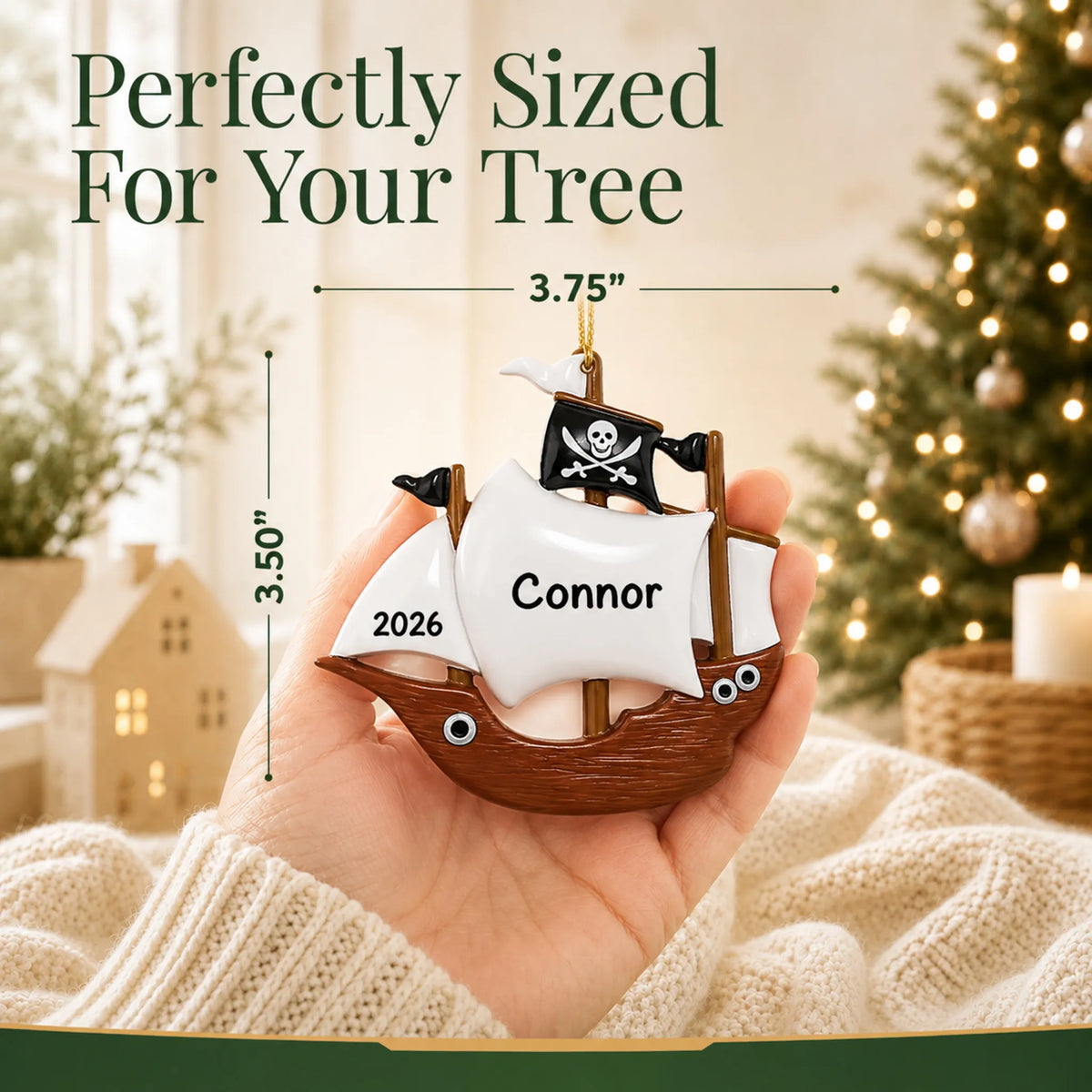 Size guide: the personalized pirate ship kids christmas ornament is 3.75 in wide by 3.50 in tall, shown in hand