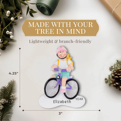 Adorno navideño de niña en bicicleta - Rubia 