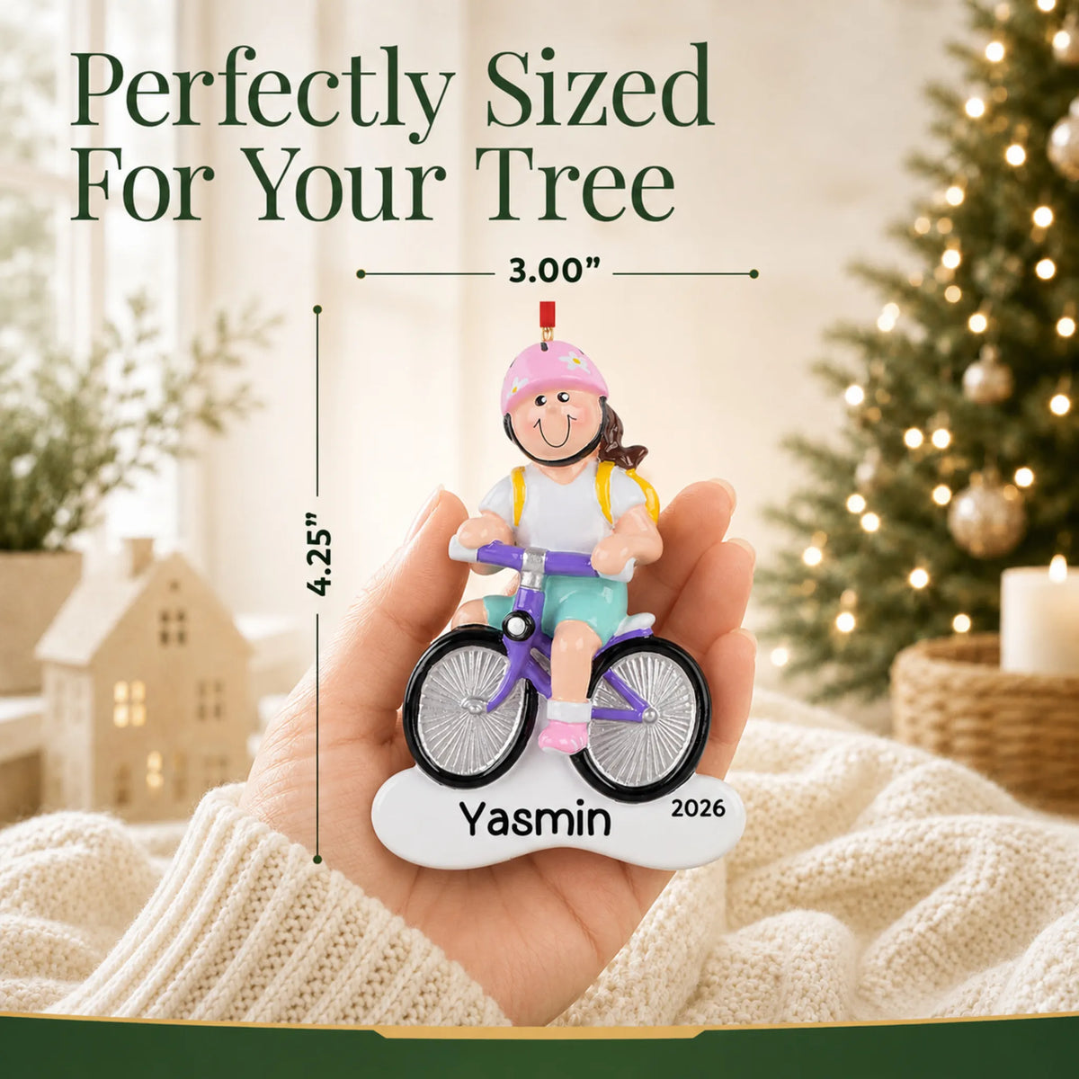 Size guide: the personalized brunette girl bike christmas ornament is 3.00 in wide by 4.25 in tall, shown in hand