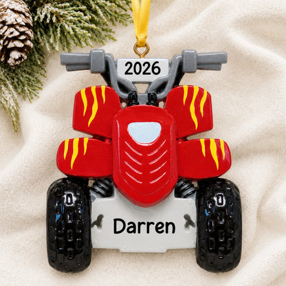 Personalized ATV quad christmas ornament laid on a soft white knit blanket