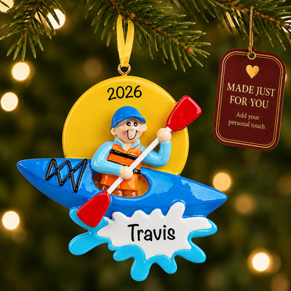 Kayak guy christmas ornament hanging on a lit Christmas tree with a Made Just For You gift tag