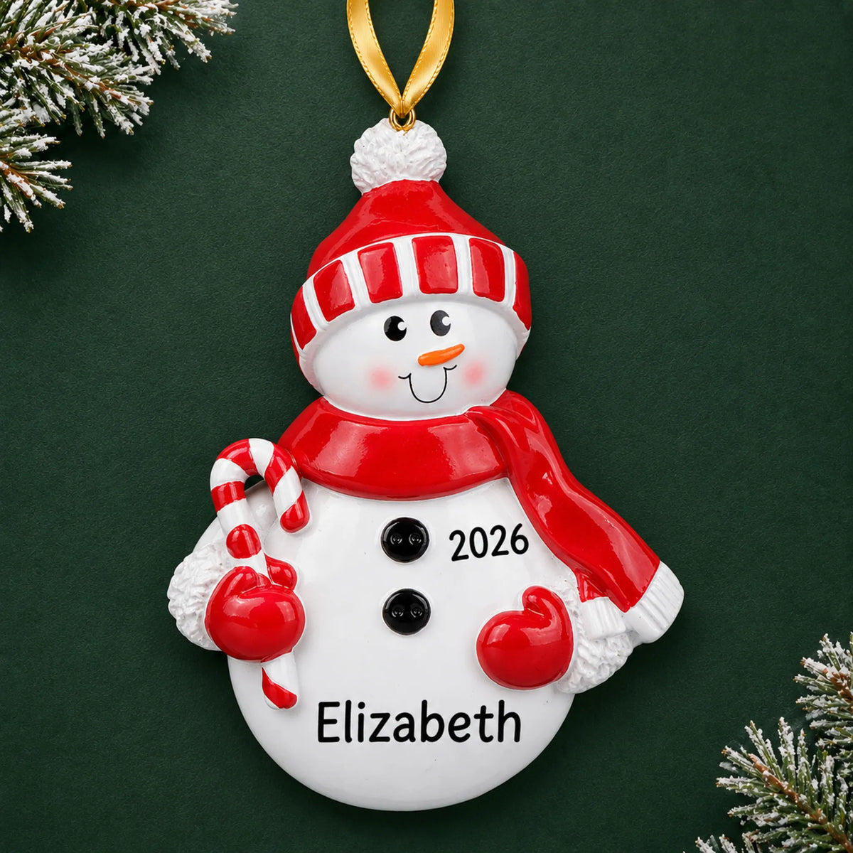 Personalized Snowman Red Hat christmas ornament on a dark green pine background