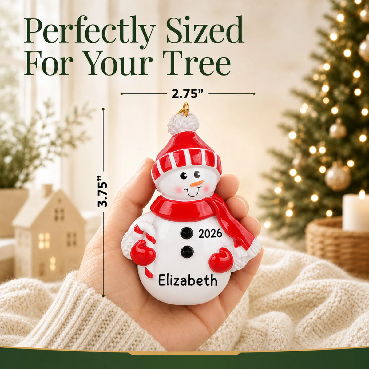 Size guide: the personalized Snowman Red Hat christmas ornament is 2.75 in wide by 3.75 in tall, shown in hand