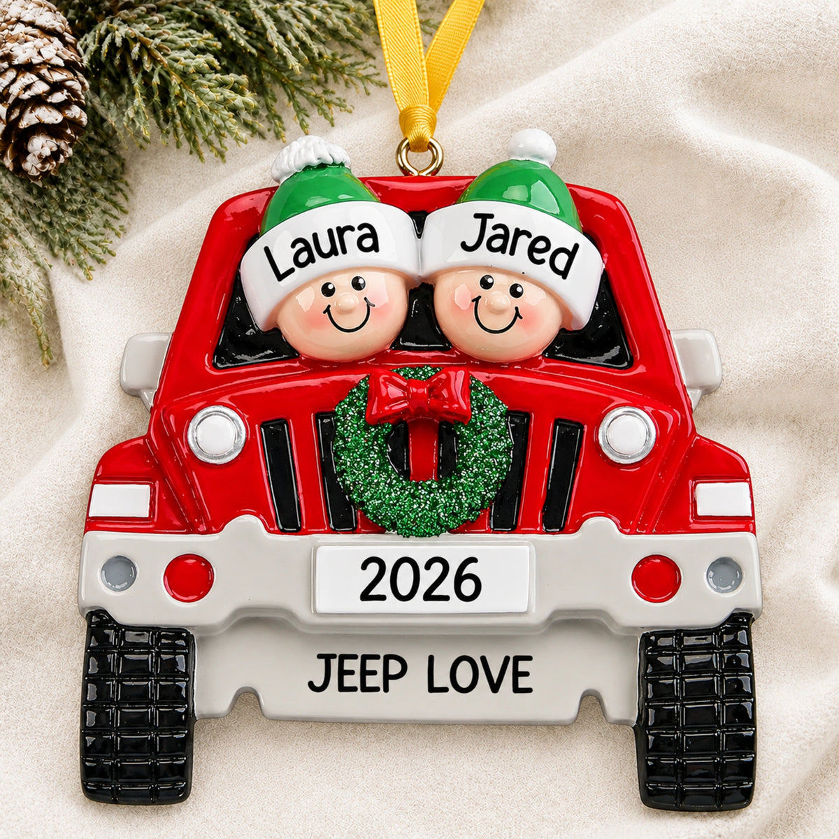 Personalized SUV couple christmas ornament with both names hanging on a snowy white background
