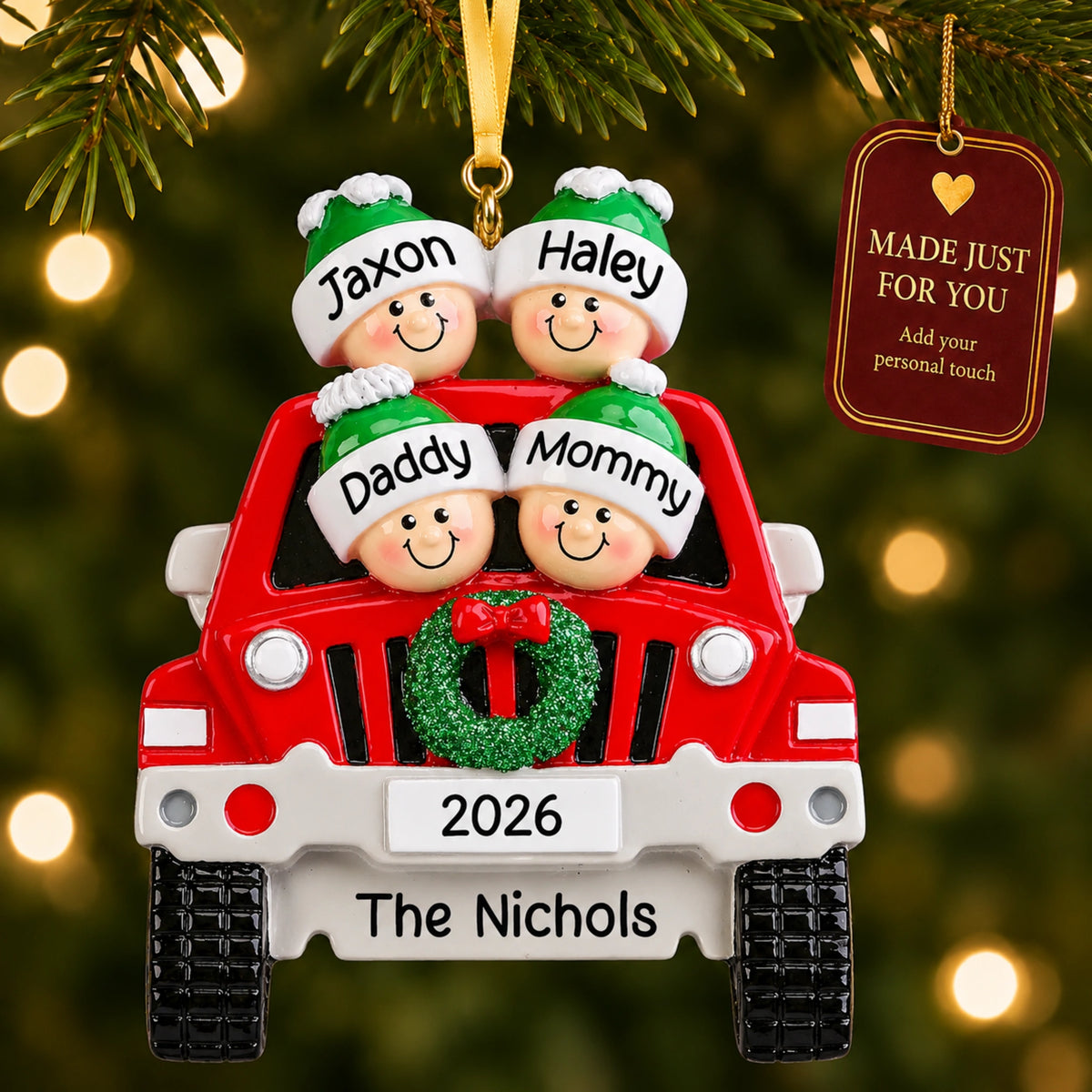 Personalized SUV family of 4 ornament hanging on a tree with Made Just For You tag