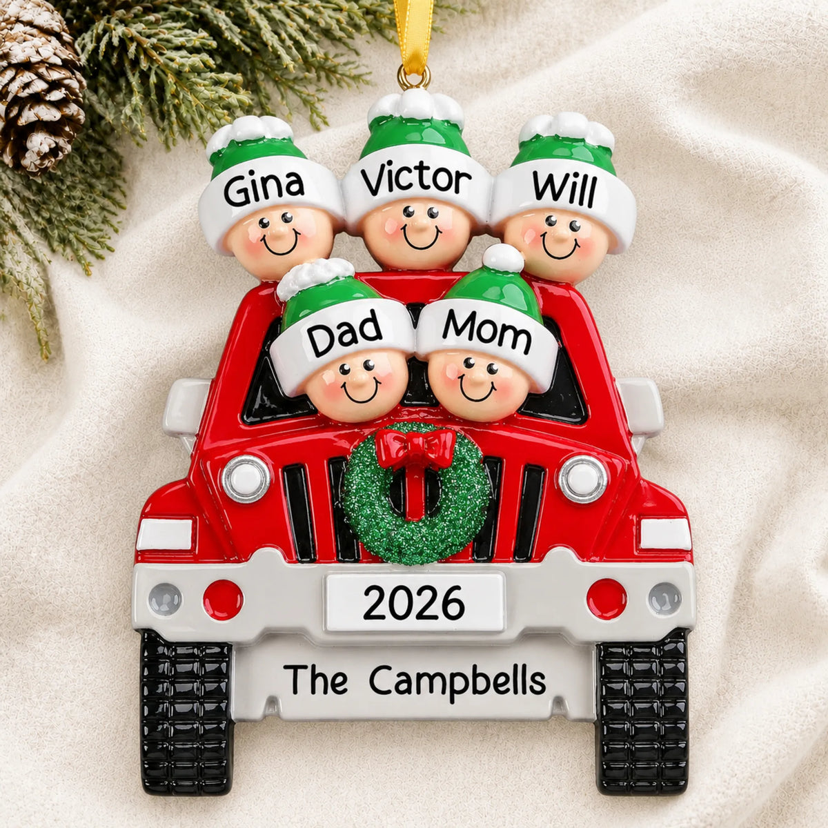 Personalized suv family of 5 christmas ornament laid on a soft white knit blanket