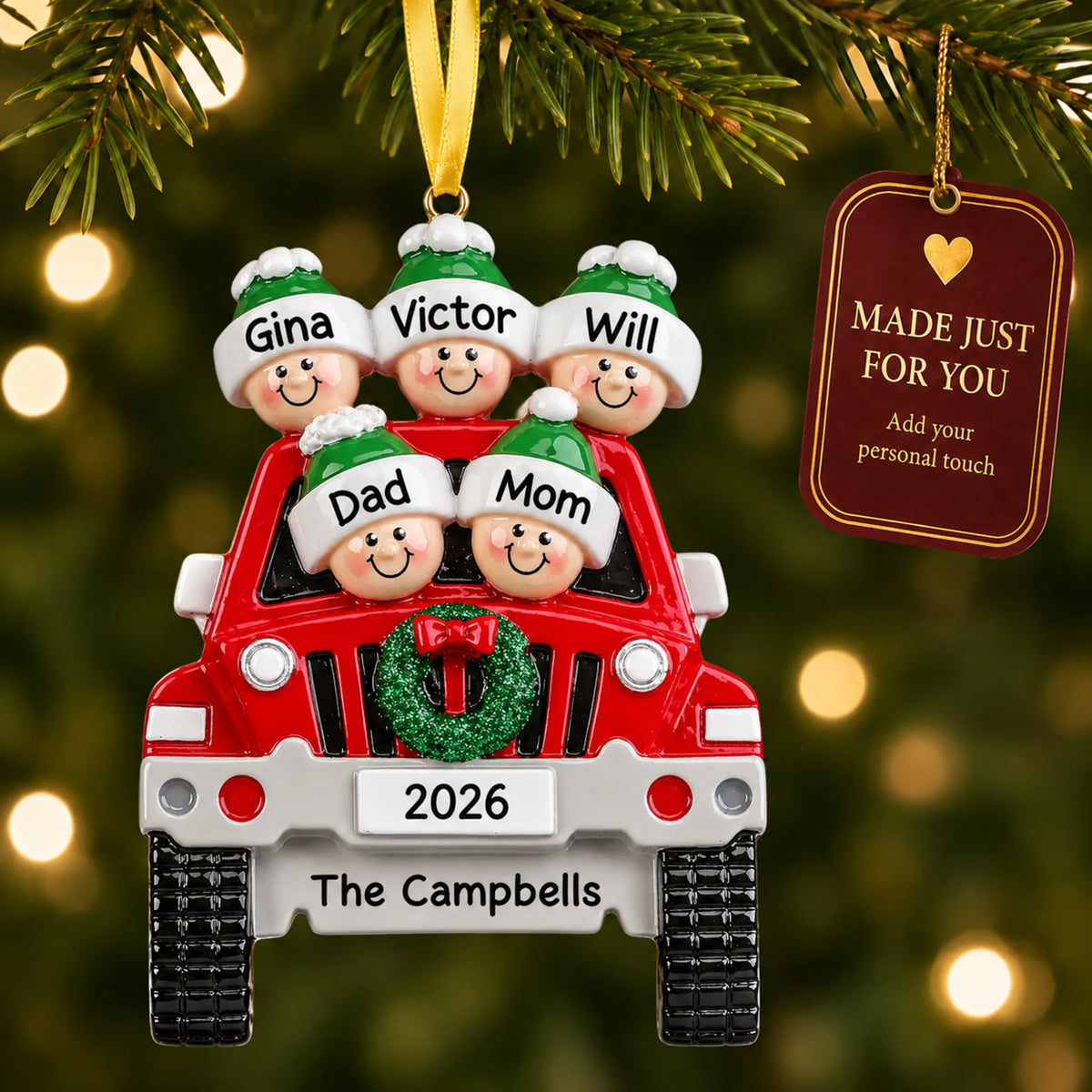 Suv family of 5 christmas ornament hanging on a lit Christmas tree with a Made Just For You gift tag