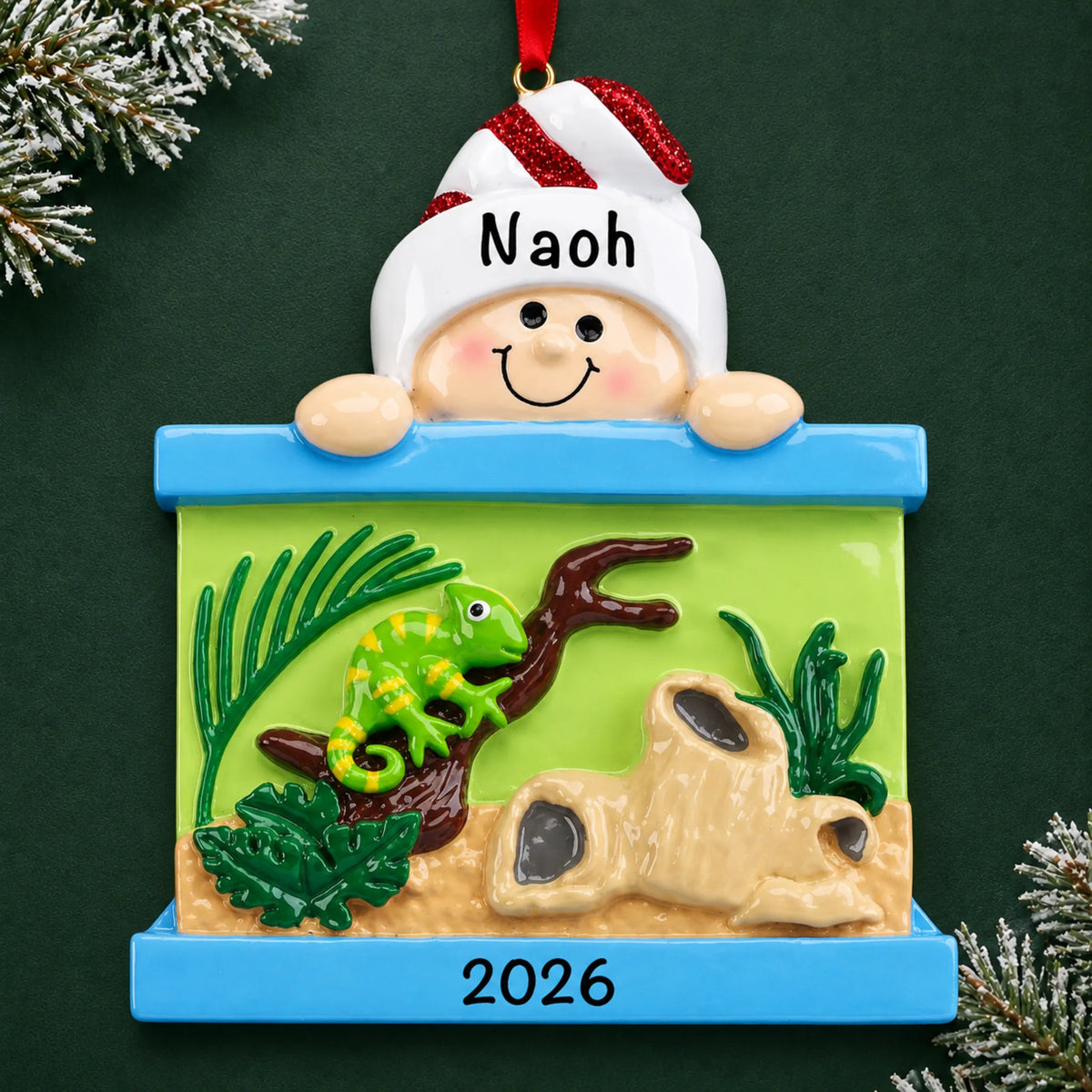 Personalized Reptile Lover christmas ornament on a dark green pine background