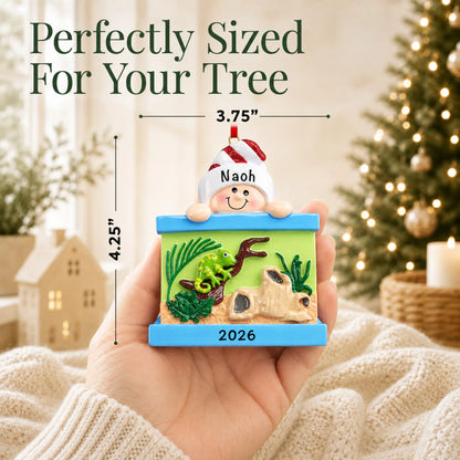 Size guide: the personalized Reptile Lover christmas ornament is 3.75 in wide by 4.25 in tall, shown in hand