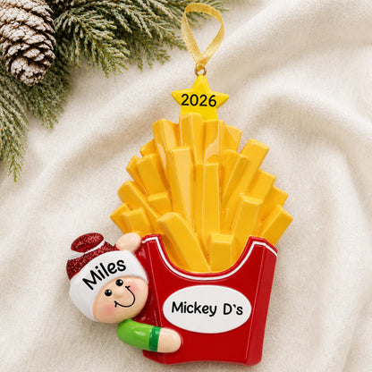 Personalized French Fries christmas ornament laid on a soft white knit blanket