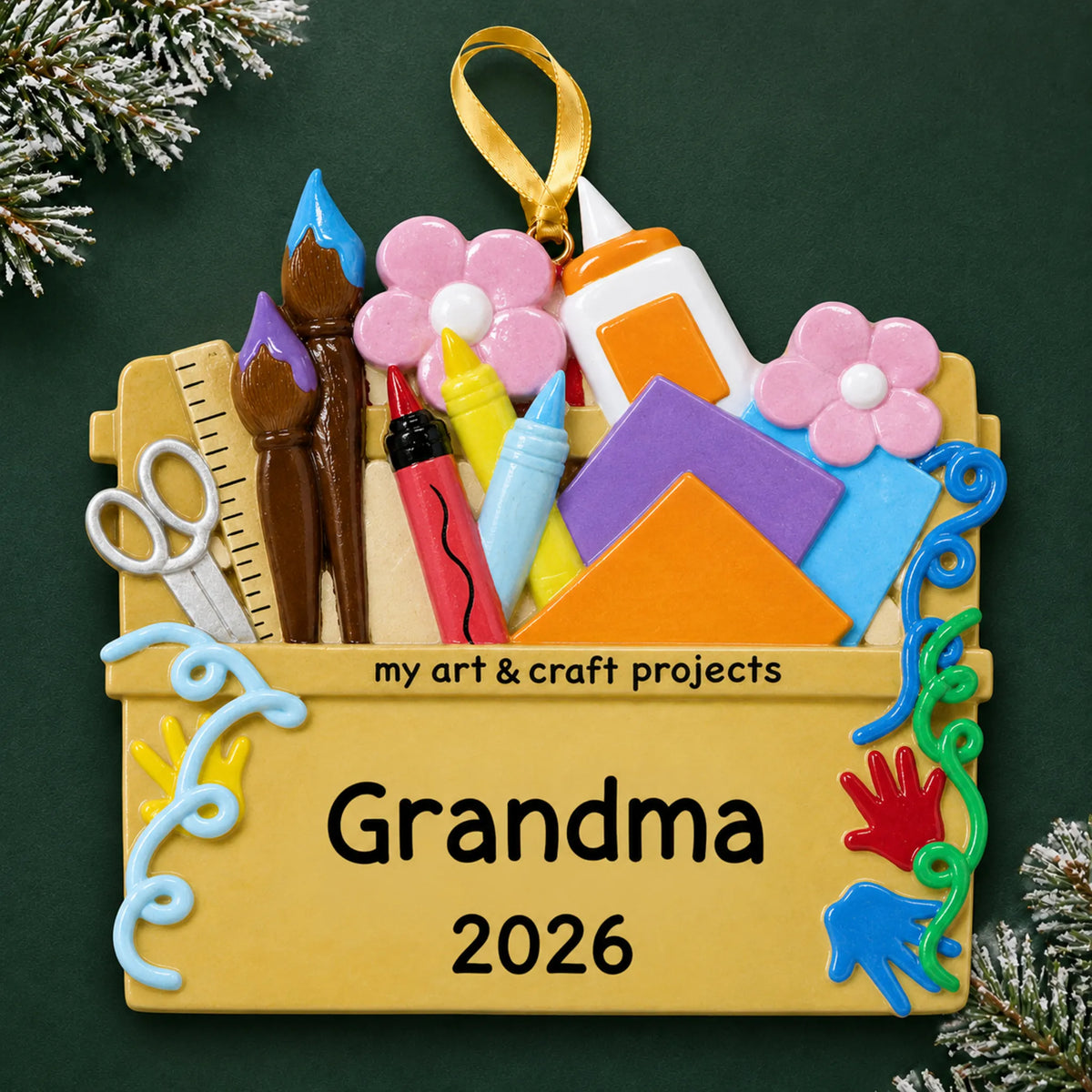 Personalized arts and craft supplies christmas ornament on a dark green pine background