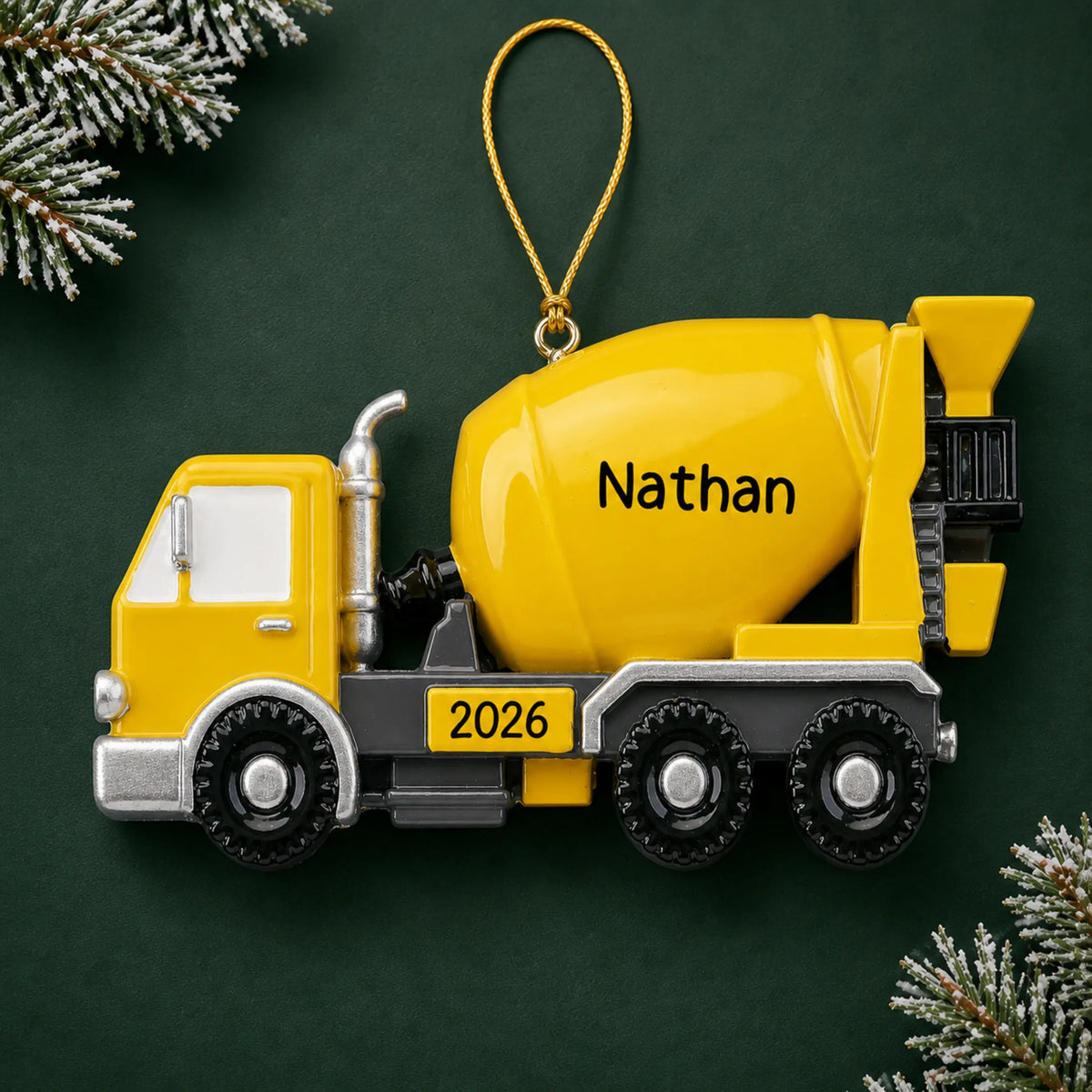 Personalized cement truck christmas ornament on a dark green pine background