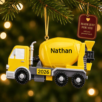 Cement truck christmas ornament hanging on a lit Christmas tree with a Made Just For You gift tag