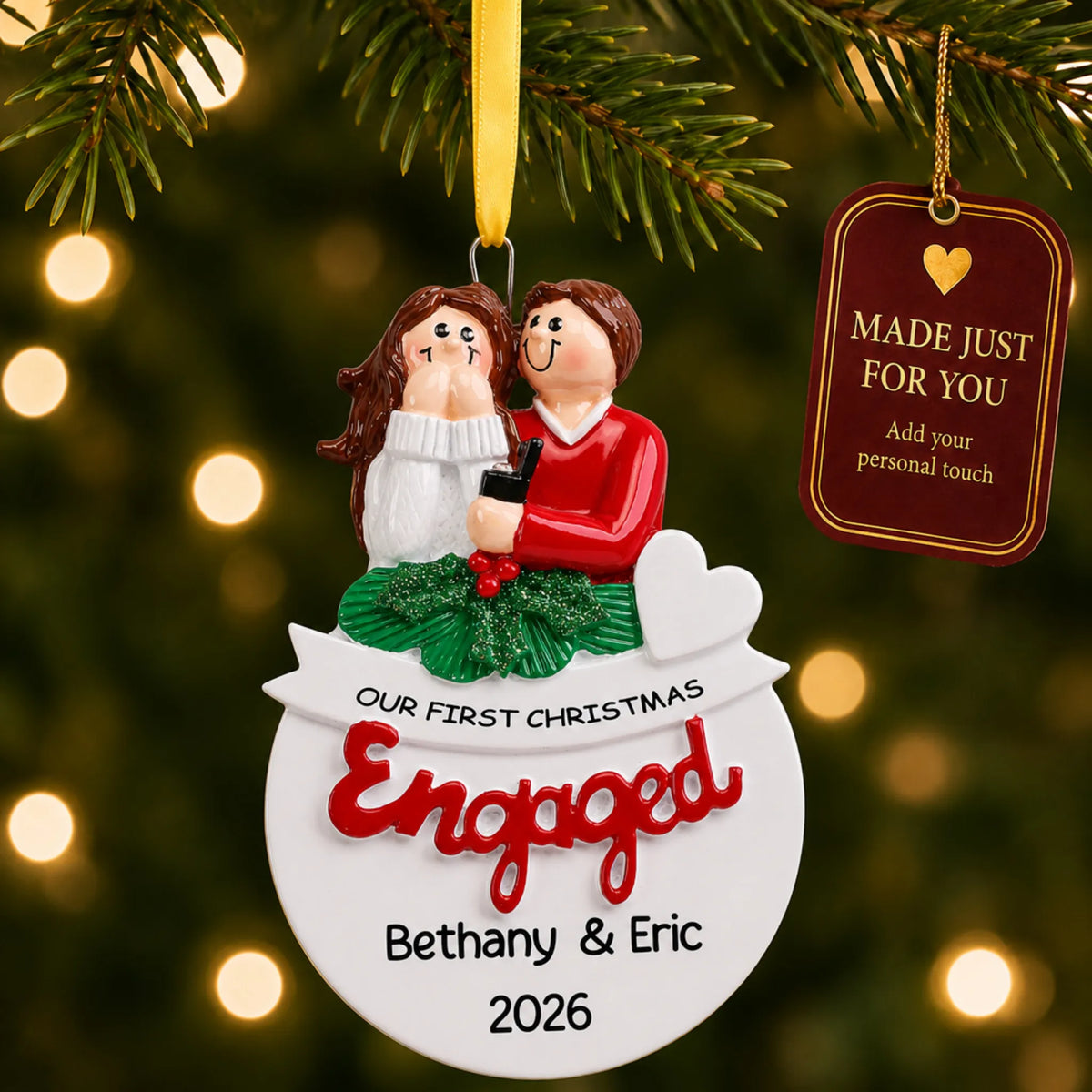 Personalized Our First Christmas Engaged Christmas ornament on a lit Christmas tree with a Made Just For You tag