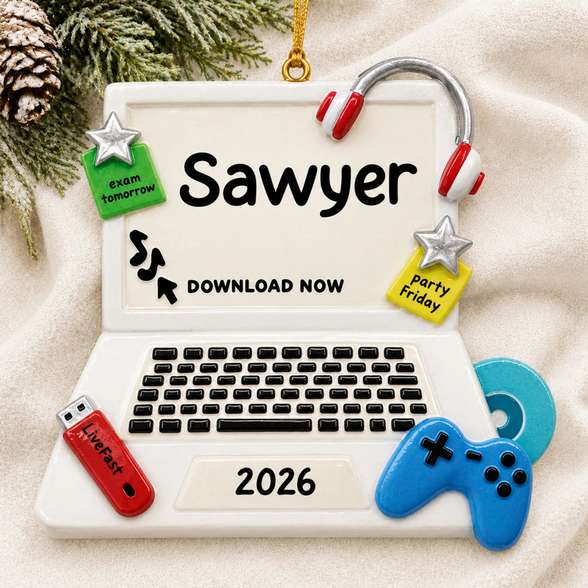 Personalized video games christmas ornament laid on a soft white knit blanket