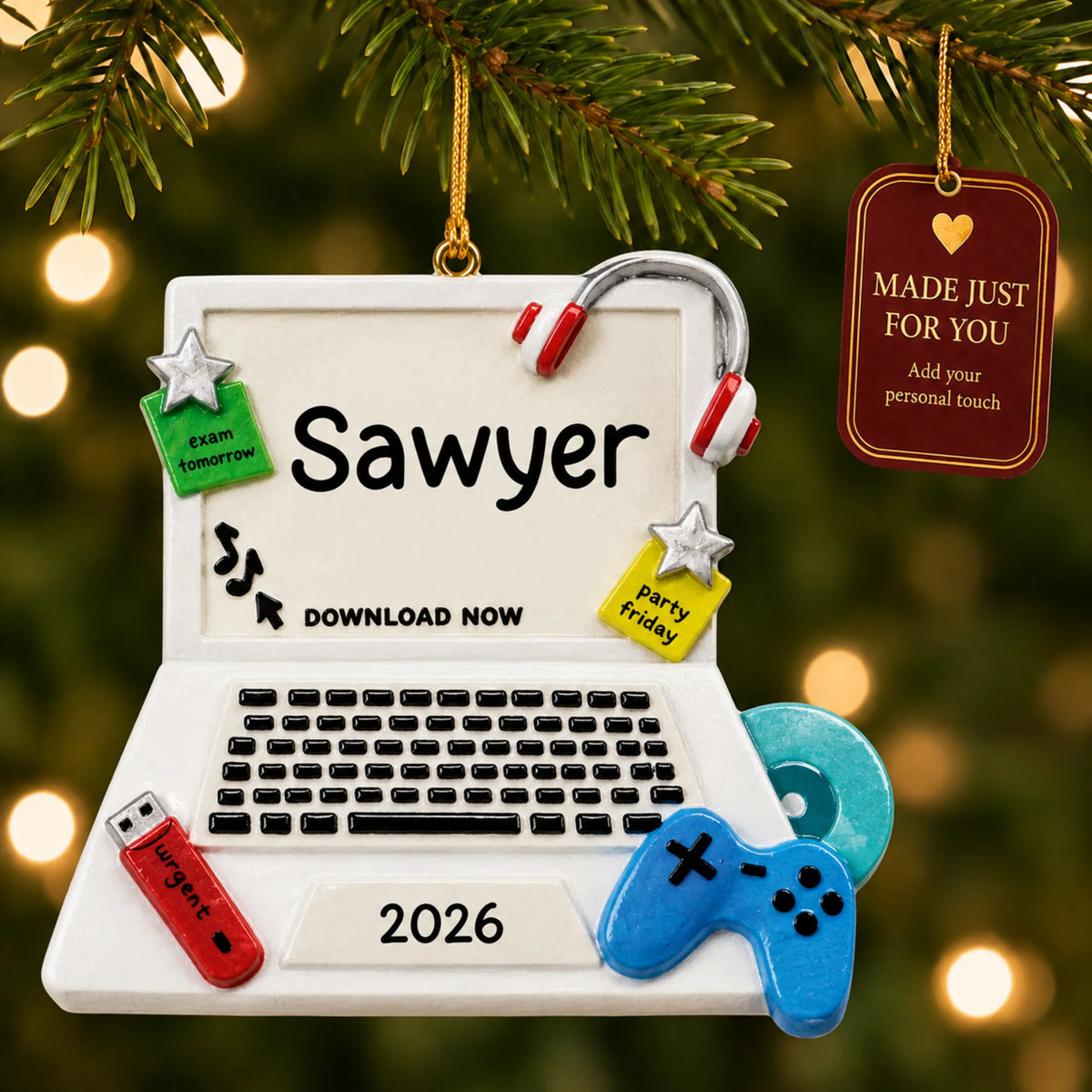 Video games christmas ornament hanging on a lit Christmas tree with a Made Just For You gift tag