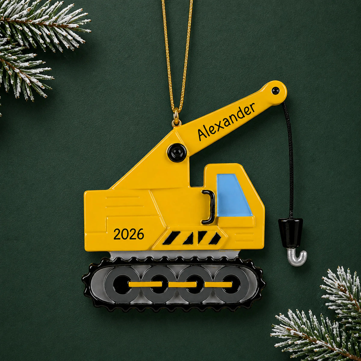 Personalized construction crane christmas ornament on a dark green pine background