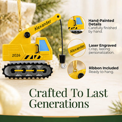 Hand-painted details and laser engraved personalization on the construction crane christmas ornament, ribbon included
