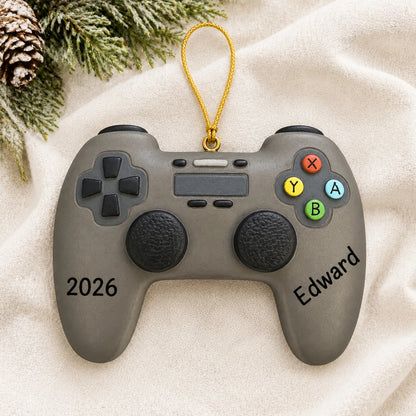 Personalized 3d video game controller christmas ornament laid on a soft white knit blanket
