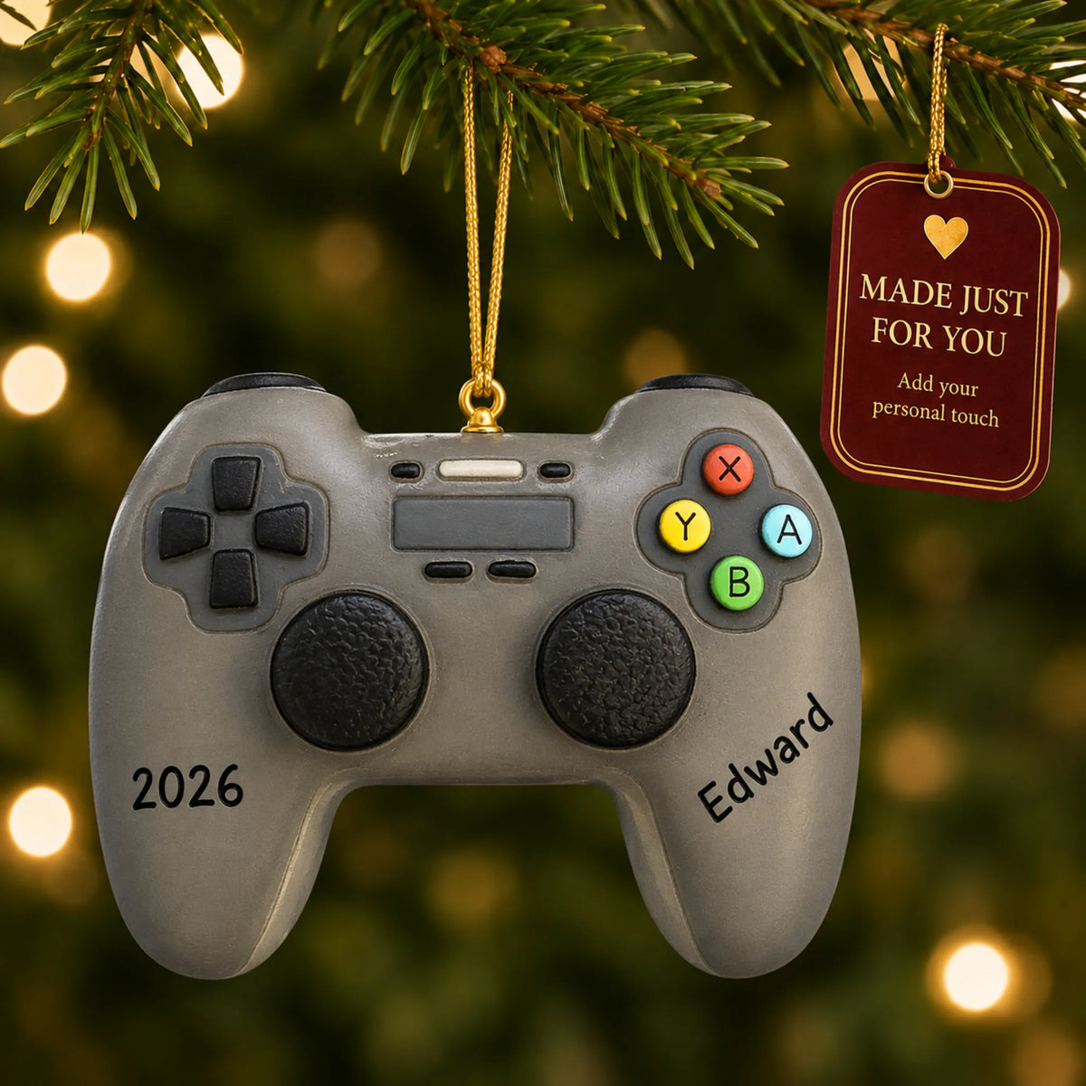 3d video game controller christmas ornament hanging on a lit Christmas tree with a Made Just For You gift tag