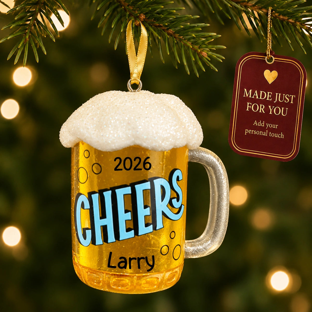 Personalized beer mug Christmas ornament hanging on a lit Christmas tree beside a Made Just For You gift tag