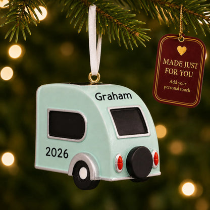 Teardrop camper trailer christmas ornament hanging on a lit Christmas tree with a Made Just For You gift tag