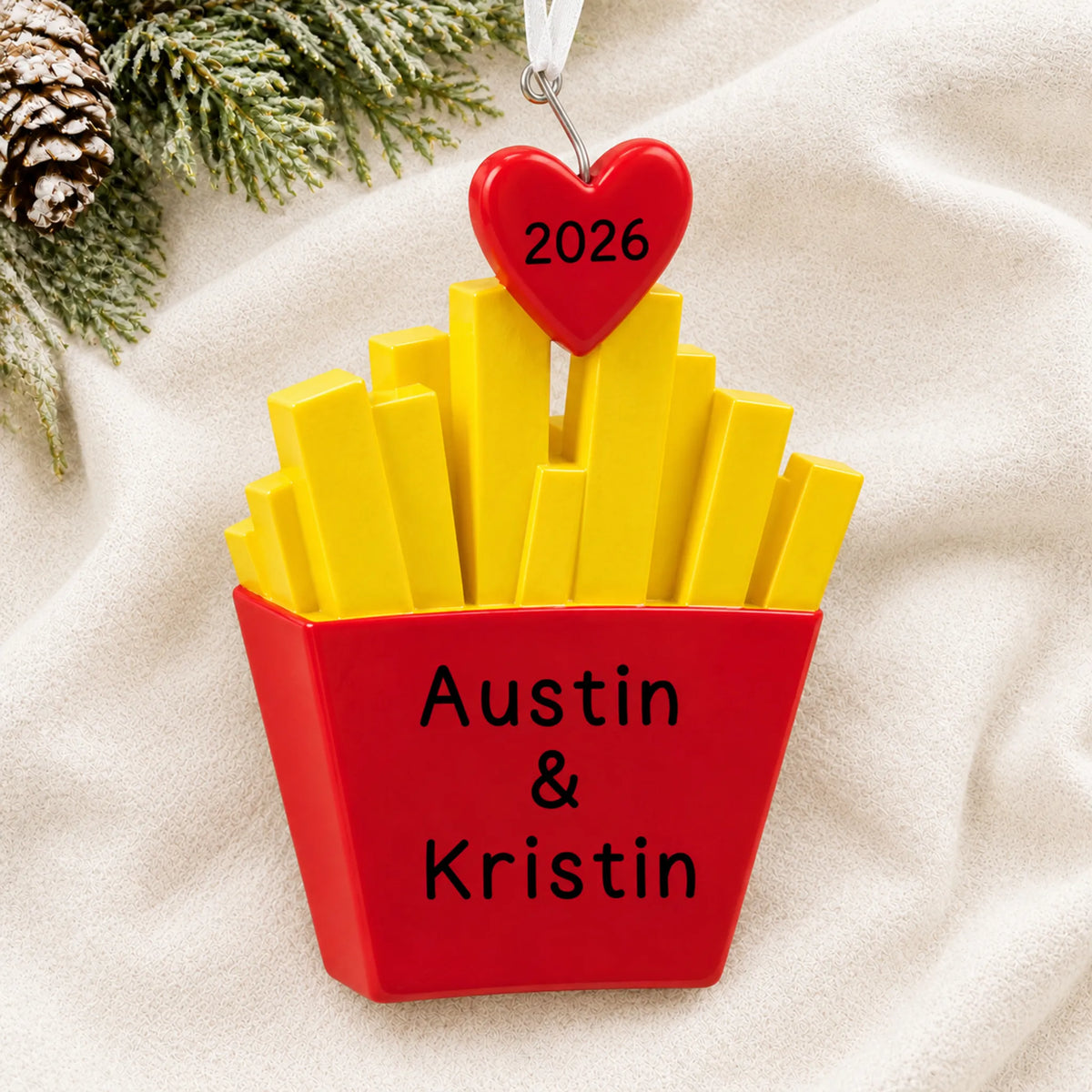 Personalized French Fries For You christmas ornament laid on a soft white knit blanket
