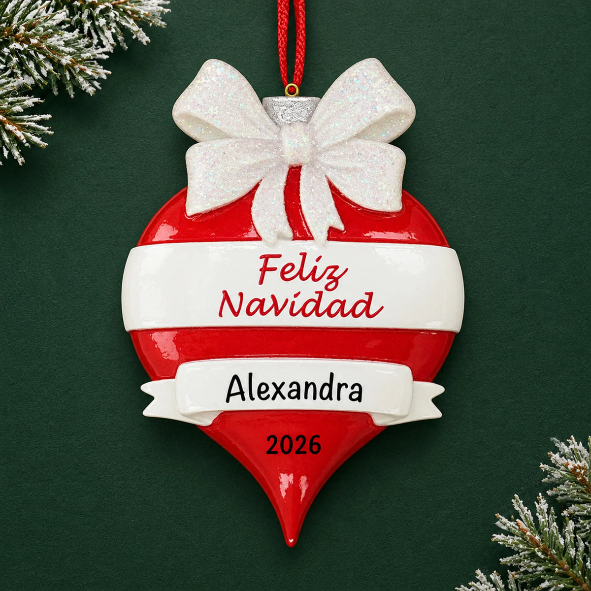 Personalized Feliz Navidad christmas ornament on a dark green pine background