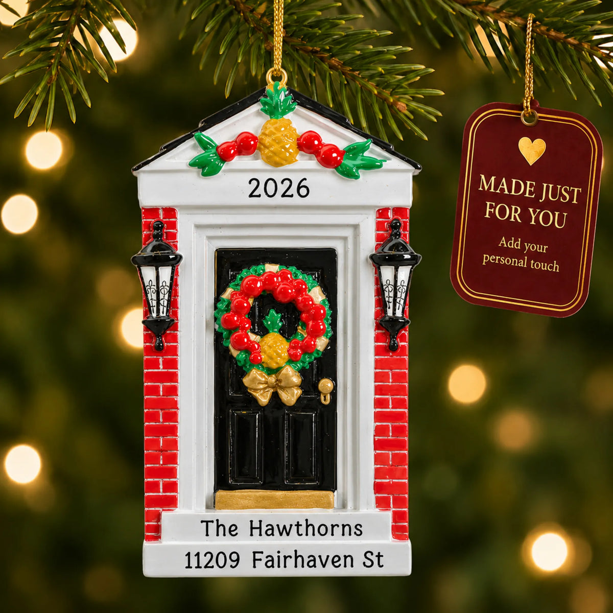 Red Brick Home Door christmas ornament hanging on a lit Christmas tree with a Made Just For You gift tag