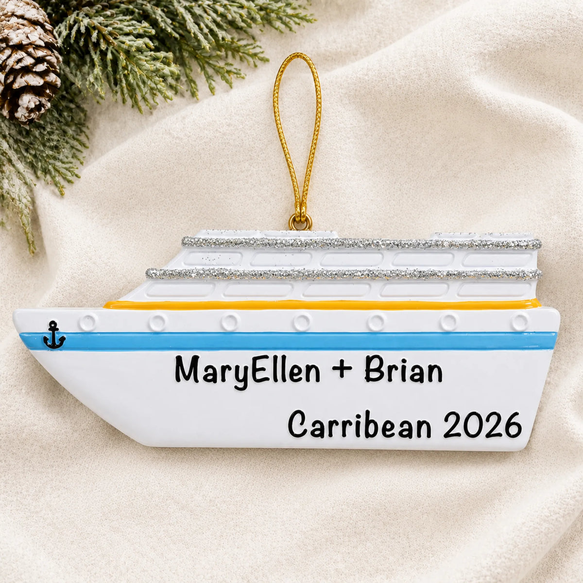Personalized cruise ship christmas ornament laid on a soft white knit blanket