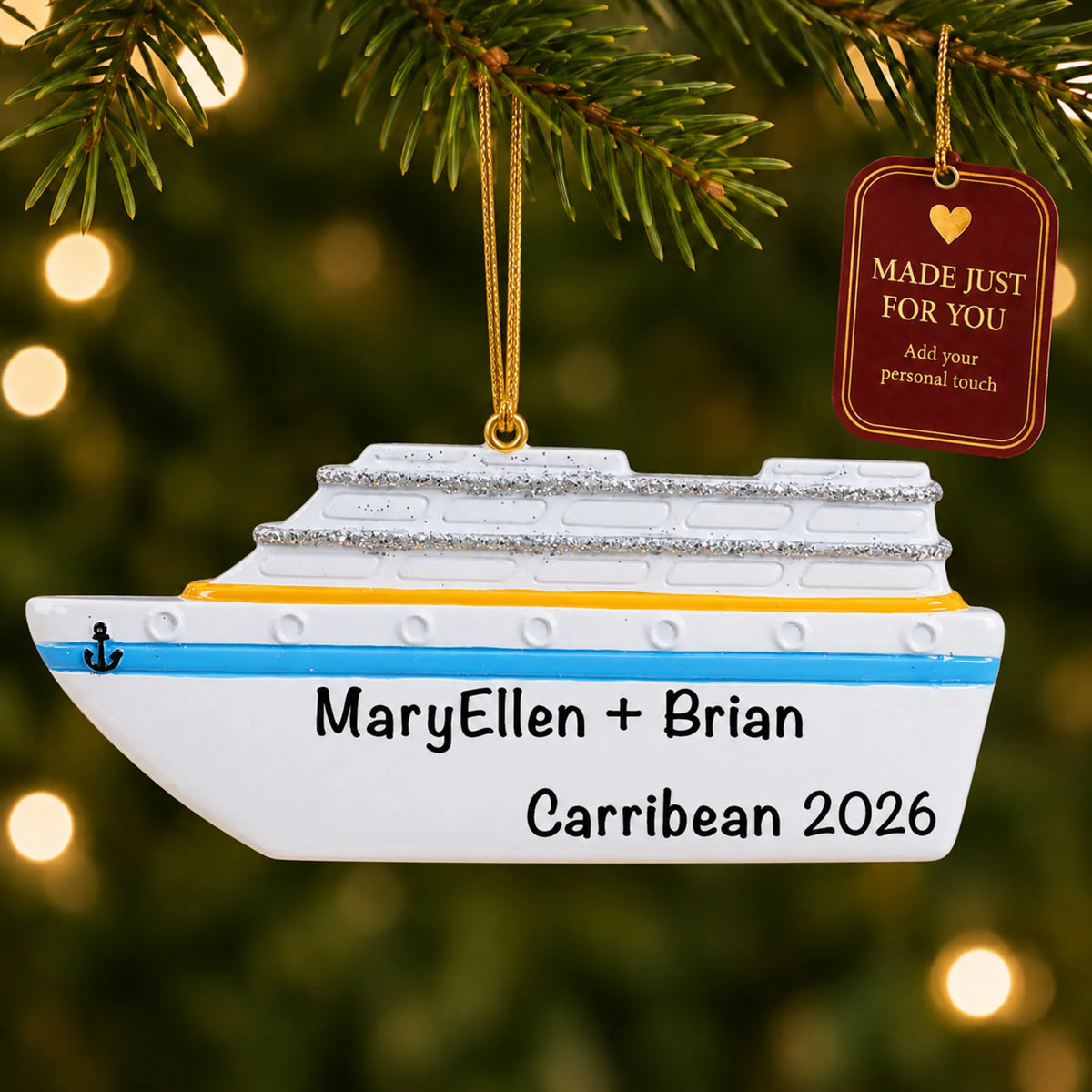 Cruise ship christmas ornament hanging on a lit Christmas tree with a Made Just For You gift tag