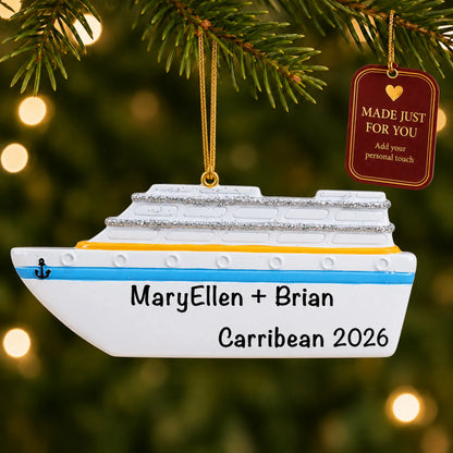 Cruise ship christmas ornament hanging on a lit Christmas tree with a Made Just For You gift tag