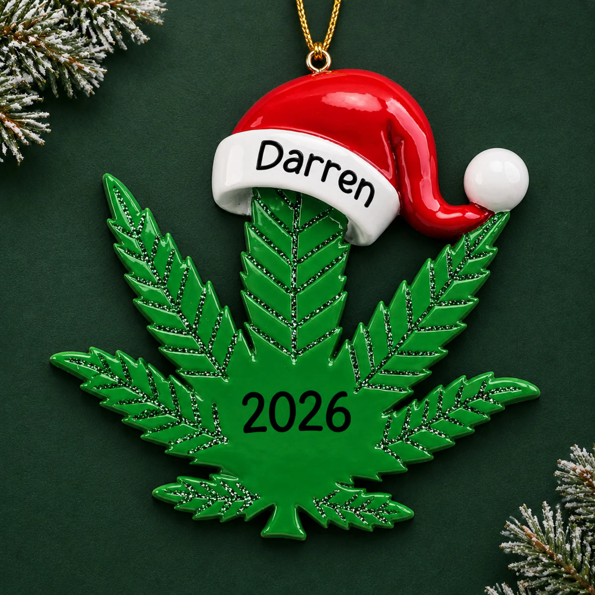 Personalized cannabis leaf santa hat christmas ornament on a dark green pine background
